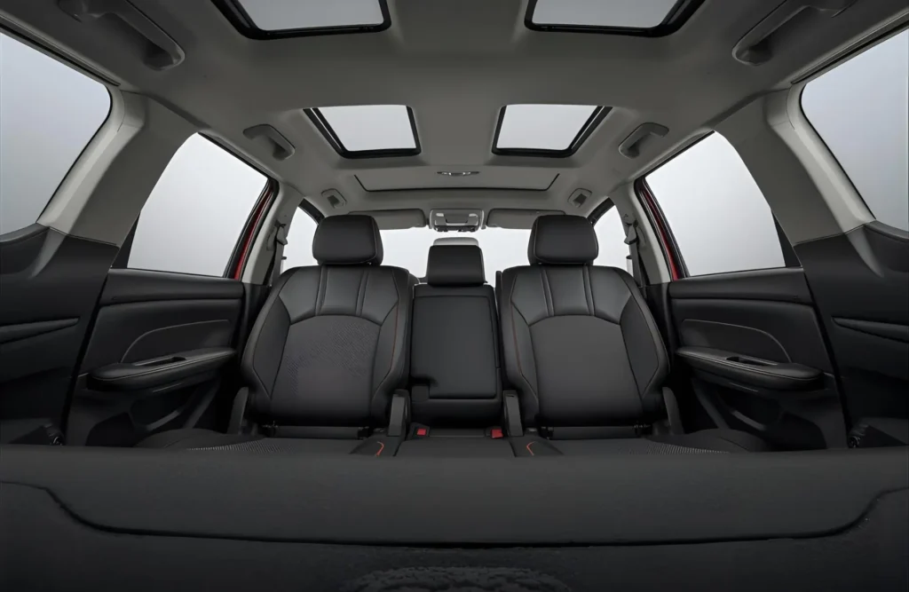 The spacious and airy 7-seater interior of the Maruti Suzuki Ertiga with roof-mounted AC vents