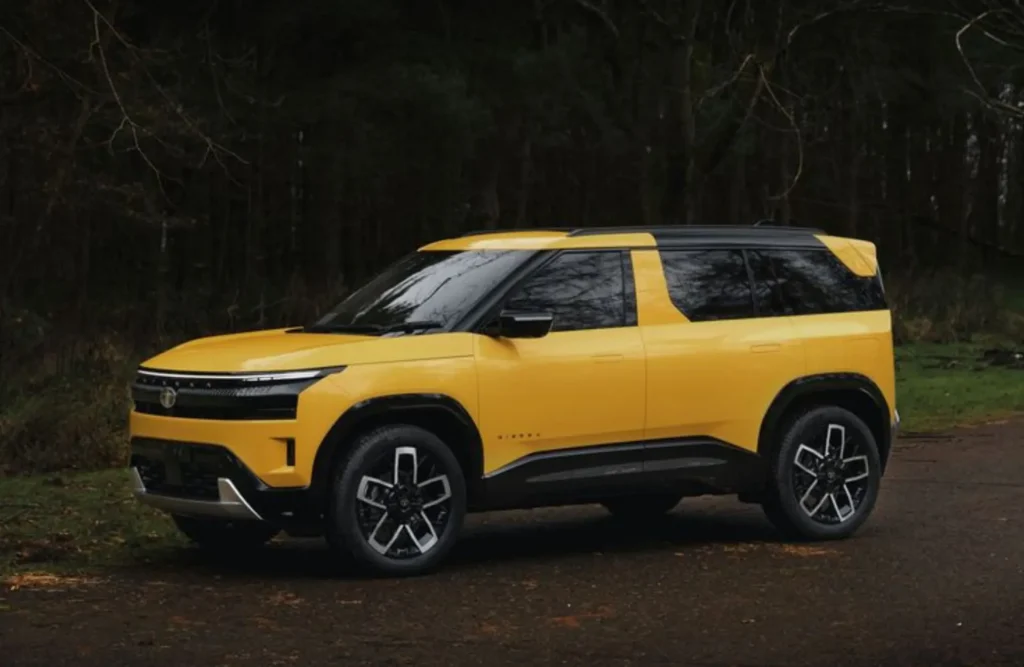 Tata Sierra SUV in yellow, showcasing turbo-petrol, diesel, and EV variants with bold design and modern styling.