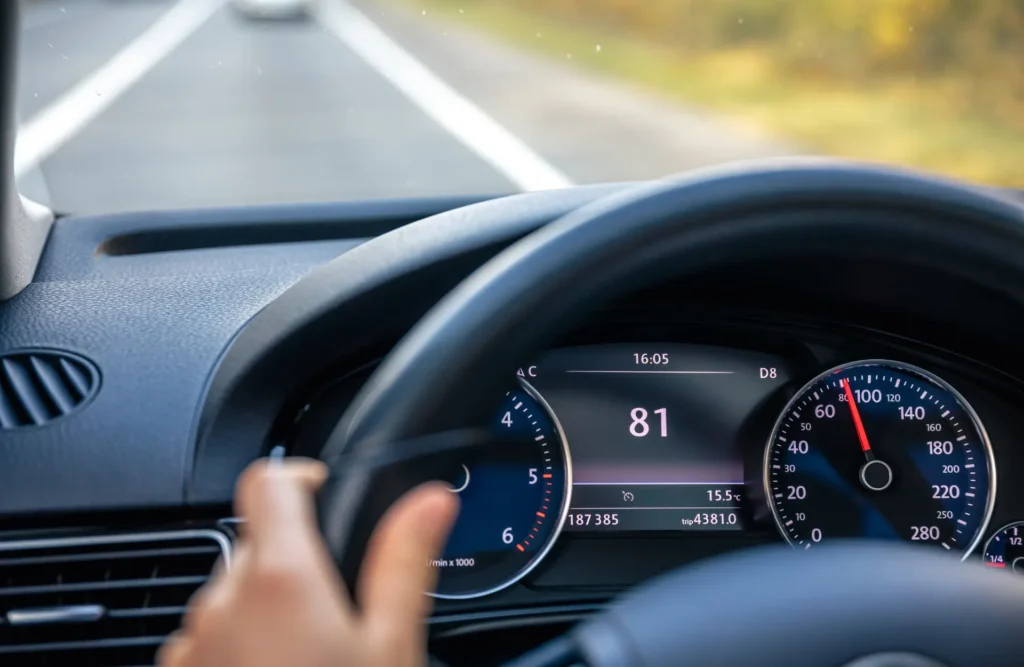 A digital car dashboard displaying high fuel efficiency after a service visit.
